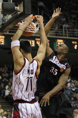 Yao dunks on Philadelpher 76er Art Long in the fourth quarter after following up on a deflected Steve Francis dunk.  The Rockets beat the Sixers 97-72, their biggest win differential of the season.